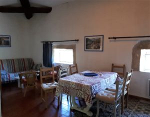 Le Tineiral à Néffies, apartment Les Romarins. It can be found on the upper floor and sits under the impressive wooden roof beams of this old winemakers house. This gite retains much of the character of the property with soft colours and the original tiled floor.